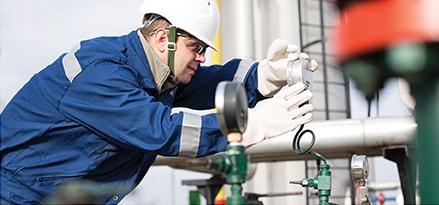 Engineer looking at industrial equipment