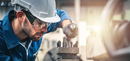 An engineer working on an industrial machine